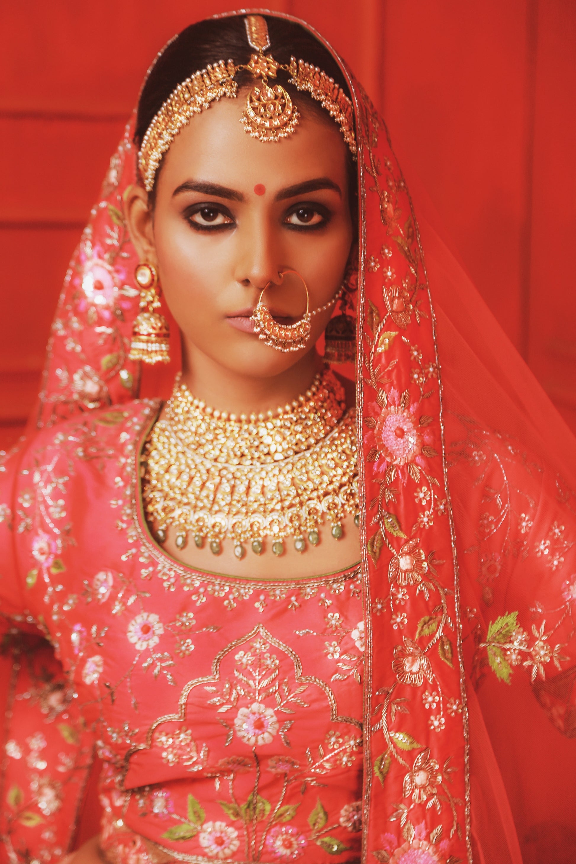 Radiant Red Bridal Ensemble with Floral Embroidery